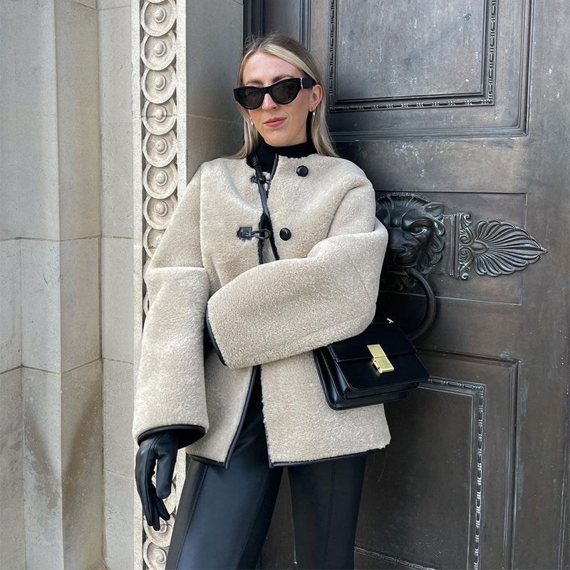 Woman modelling oversized faux fur jacket
