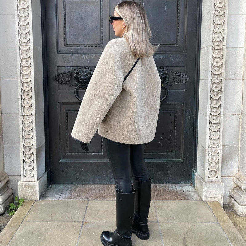 Woman modelling oversized faux fur jacket
