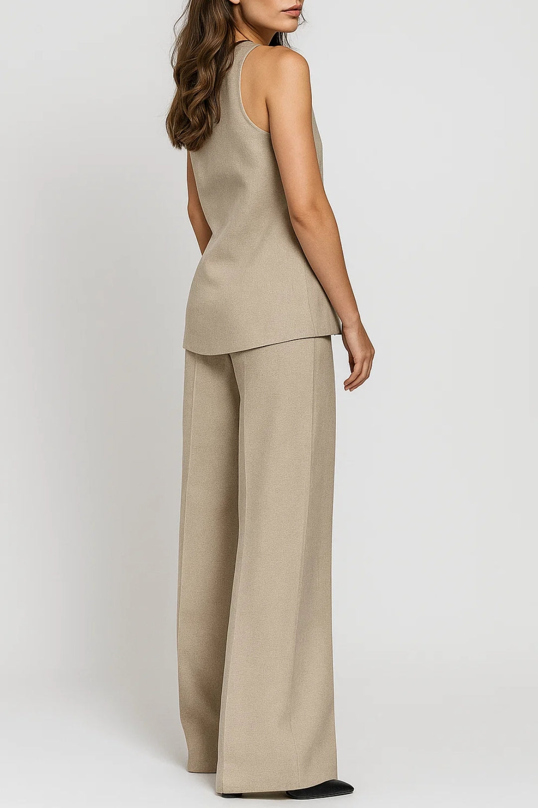 Beige taupe women's tailored vest and wide-leg trousers co-ord set, full-length view showing relaxed pant fit