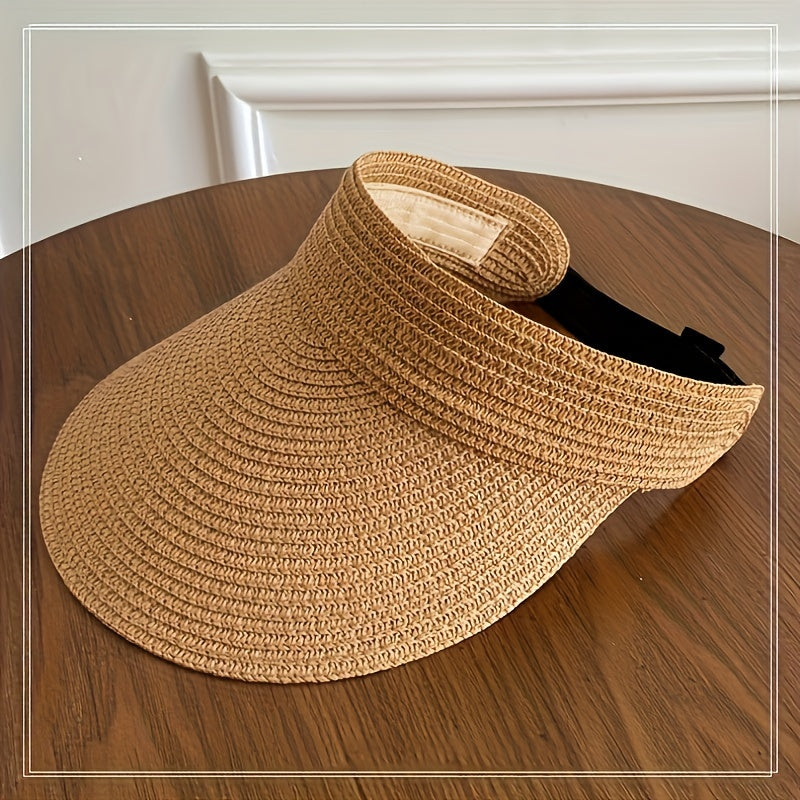 Woman wearing foldable wide brim sun visor in coffee color outdoors