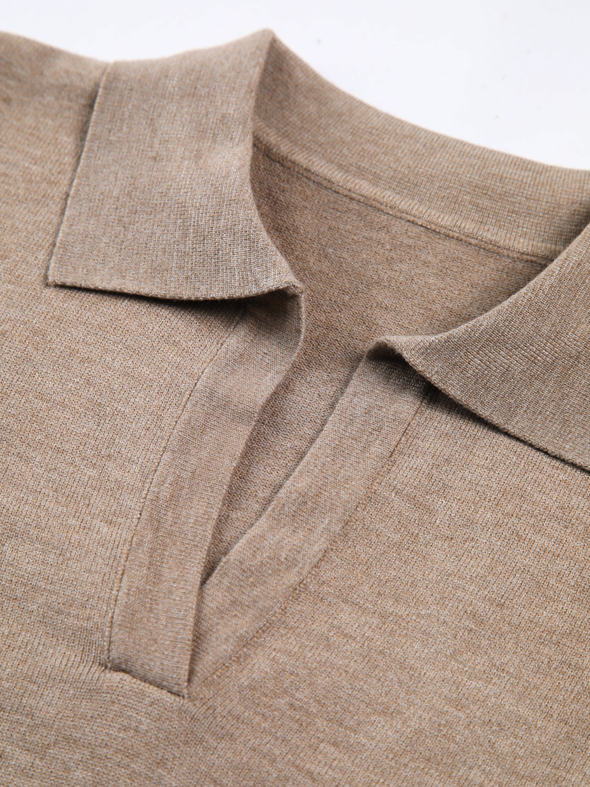 Women's knitted top showcasing the collared design