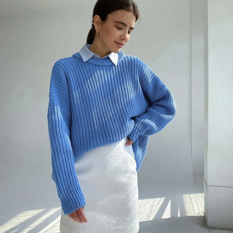 Close-up of cable knit pattern showing textured ribbed stitching
