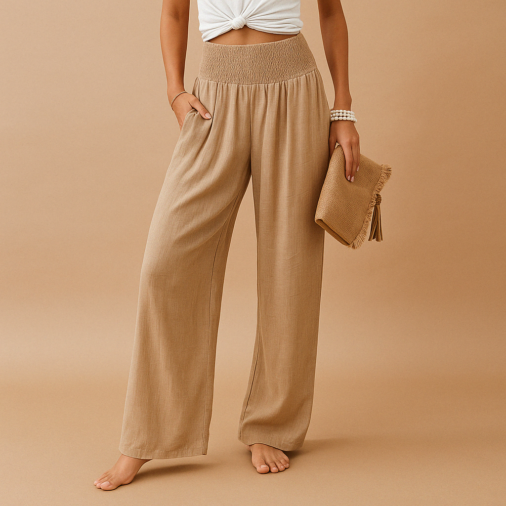 Women's high waist wide leg trousers featuring an elastic waistband and relaxed everyday fit