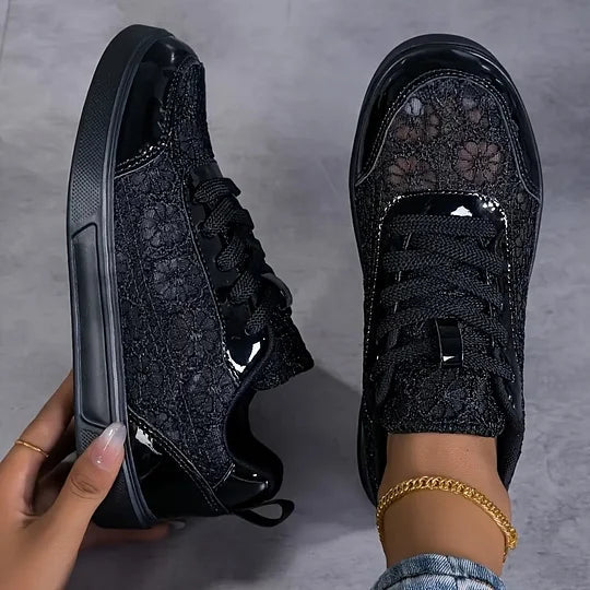 Women's black mesh sneakers with lace-up fastening, three-quarter view