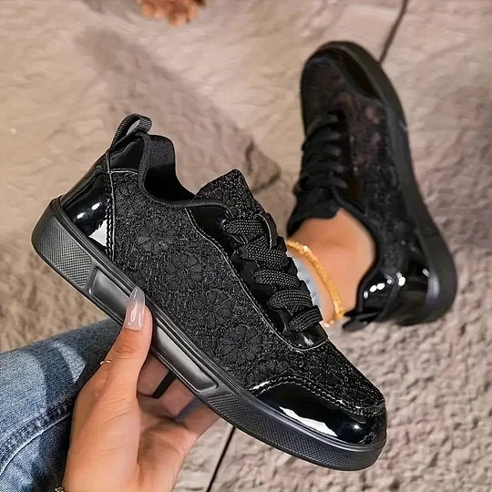 Women's black casual mesh sneakers, pair view showing low-top profile and sole
