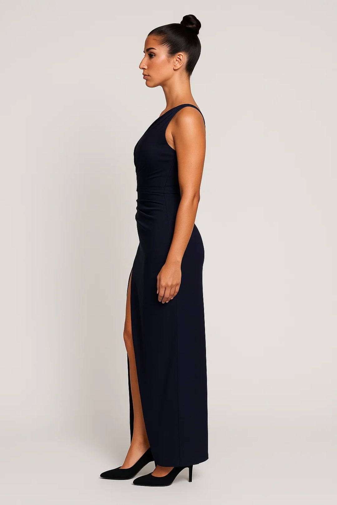 Dark blue satin-like one-shoulder maxi dress showing draped neckline detail – side view