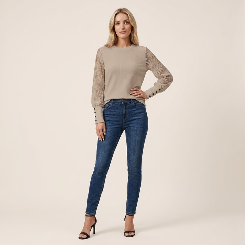 Women's pullover knit top featuring textured fabric and lace sleeves