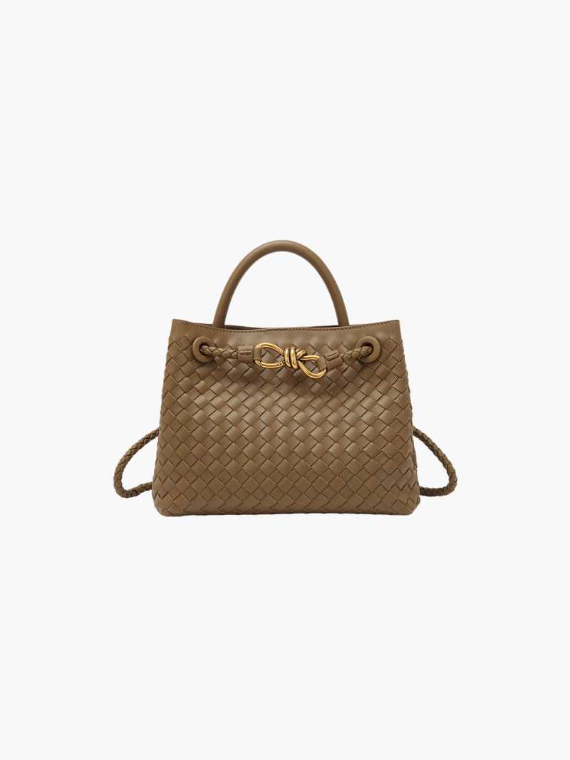 gold toned knot detail on woven synthetic leather handbag
