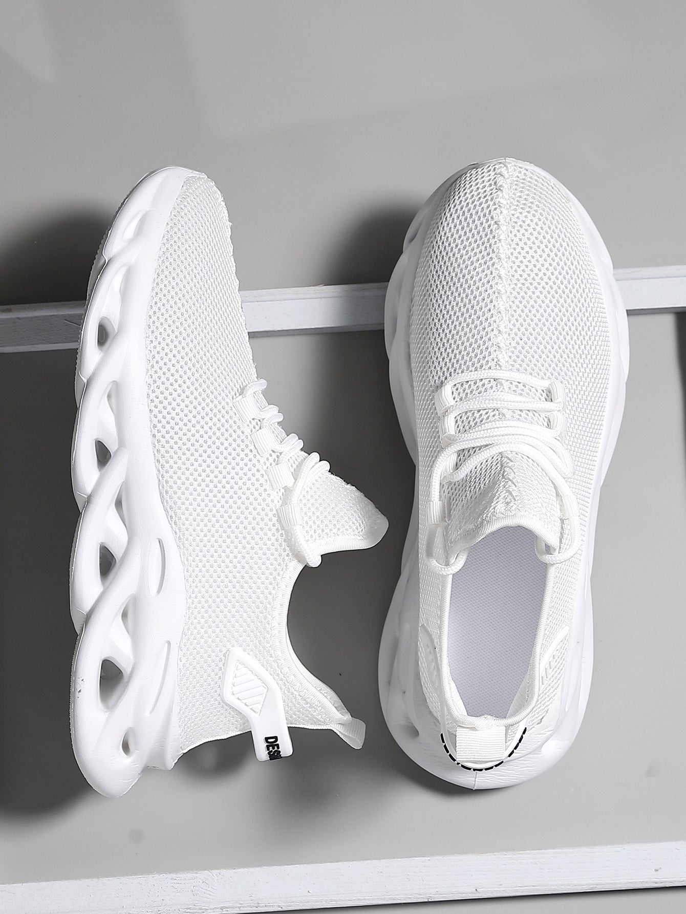 Men's athletic shoes with mesh construction and padded collar
