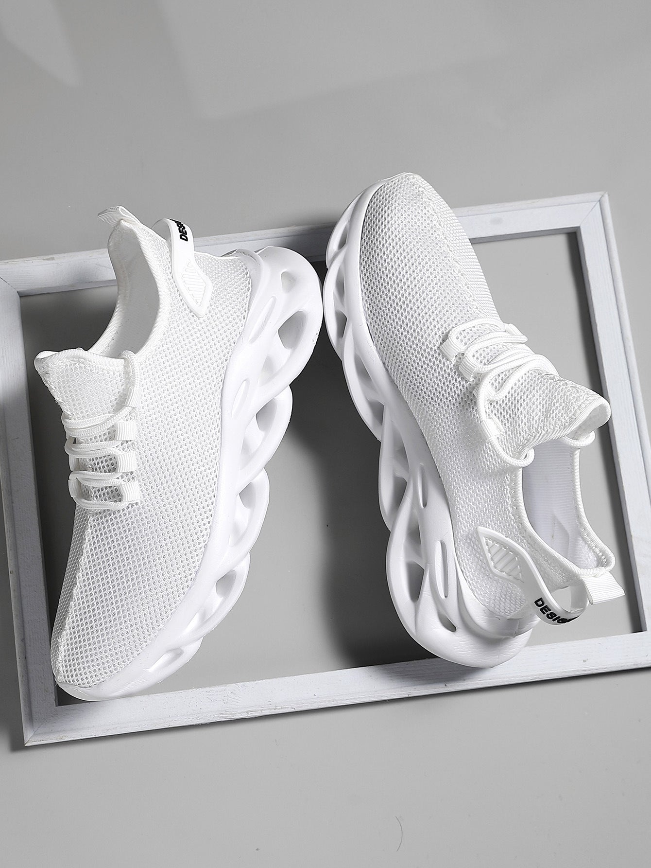 Sport trainers with ventilated upper and reinforced toe cap
