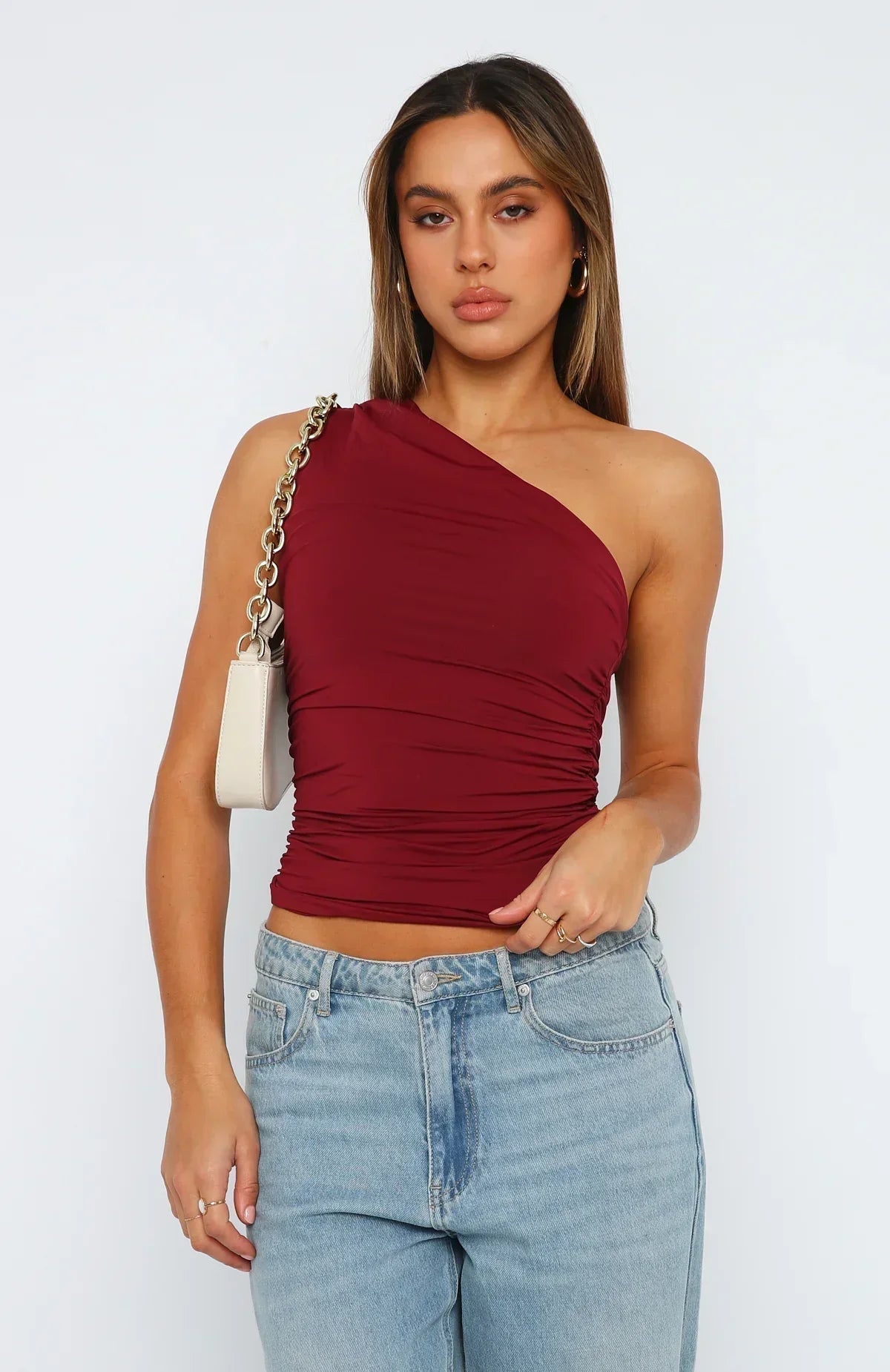 Front view of one shoulder ruched top for women