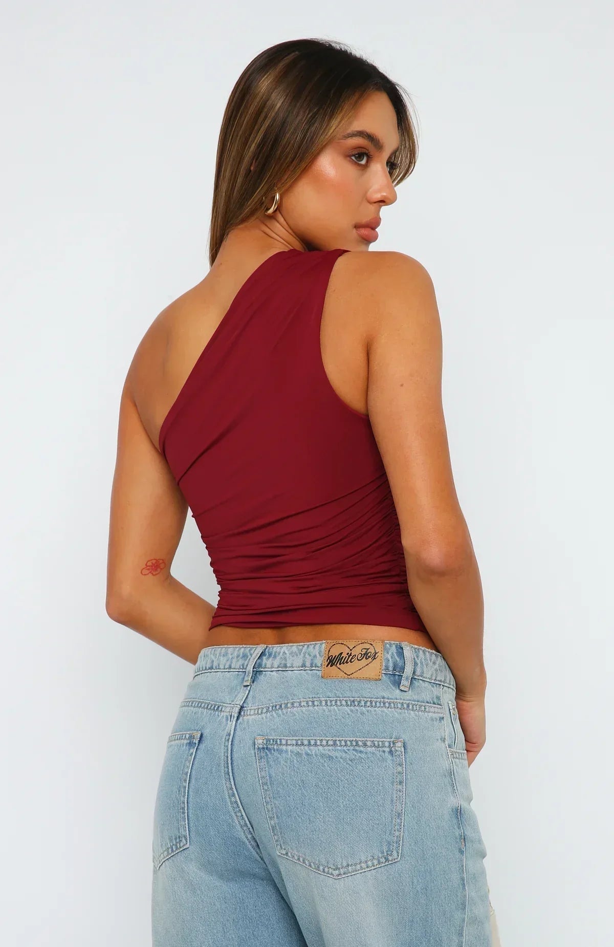 Back view of women's one shoulder top