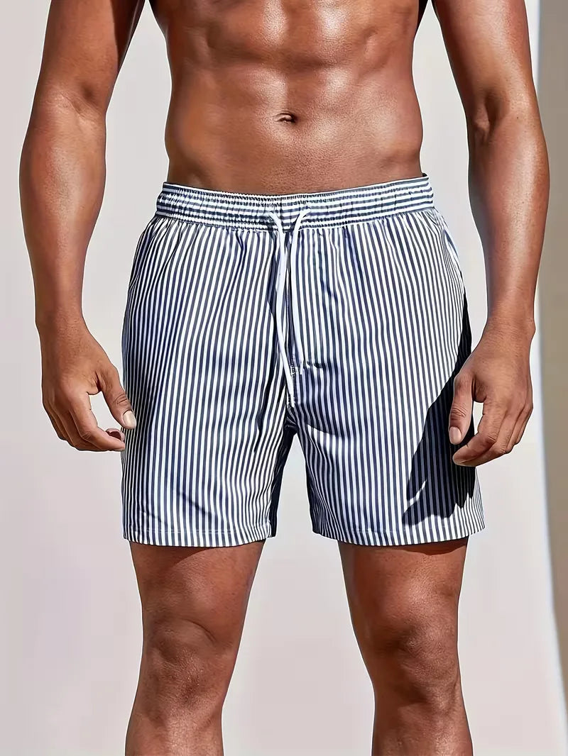 Man wearing blue and white striped swim shorts 