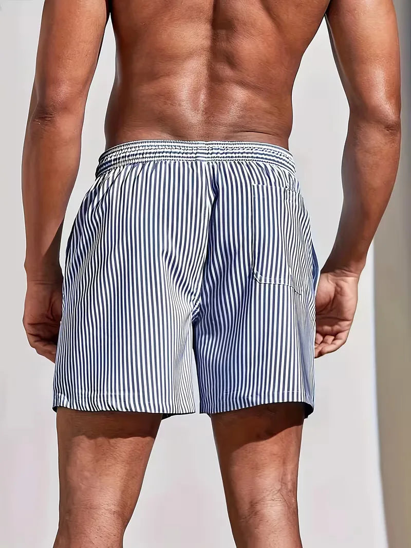 Man wearing blue and white striped swim shorts