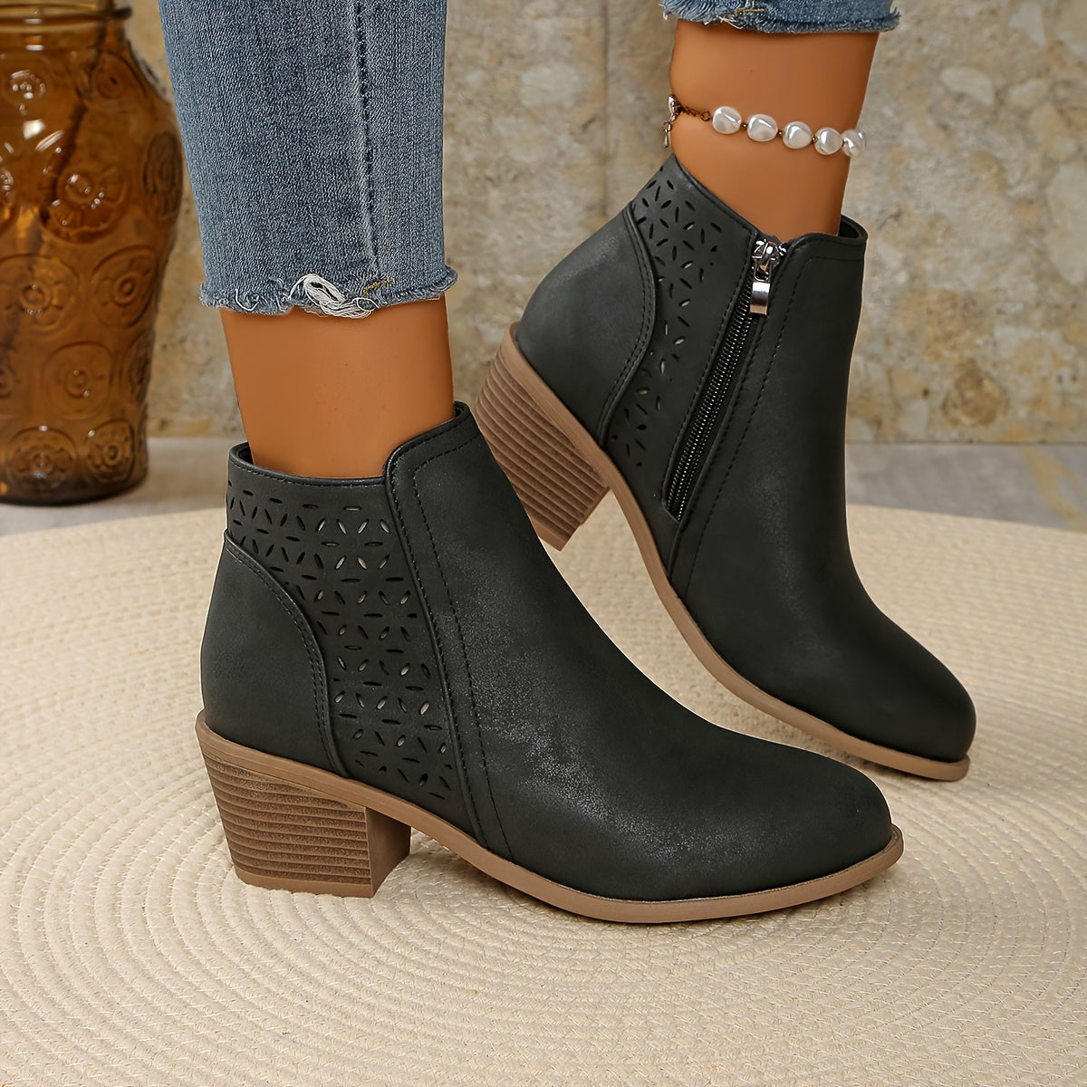 Synthetic leather ankle boots with perforated detail and side zip fastening for women

