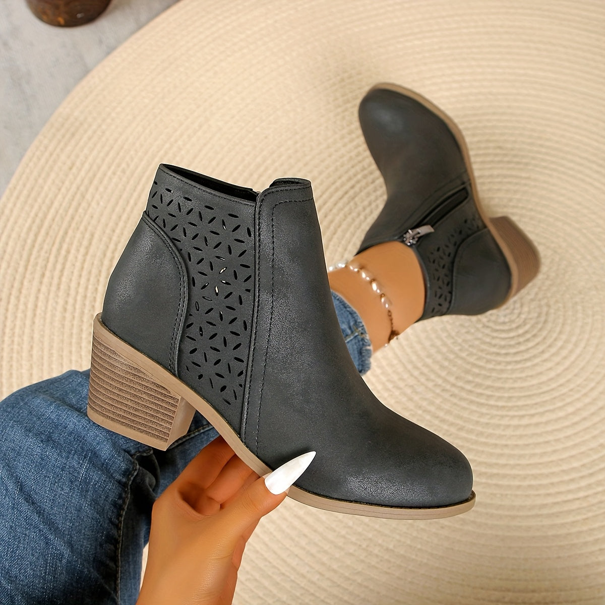 Perforated synthetic leather ankle boots with chunky sole and side zip closure
