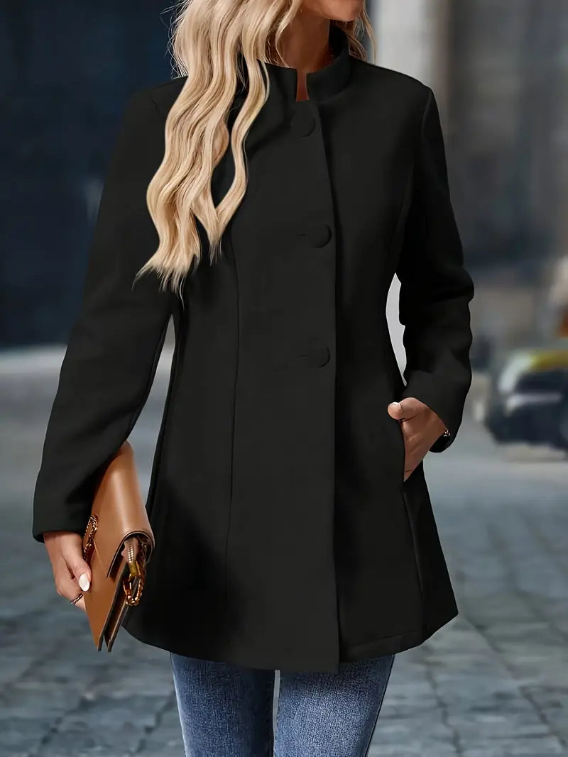 Tailored jacket displaying structured shoulder seam and sleeve detail
