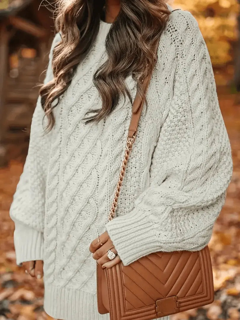 long sleeve knit dress with dropped shoulders shown from side angle